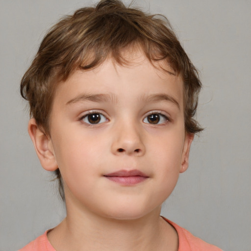 Joyful white child male with medium  brown hair and brown eyes