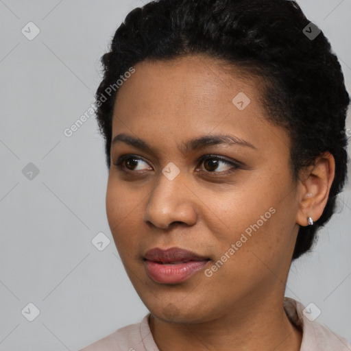 Joyful latino young-adult female with short  black hair and brown eyes