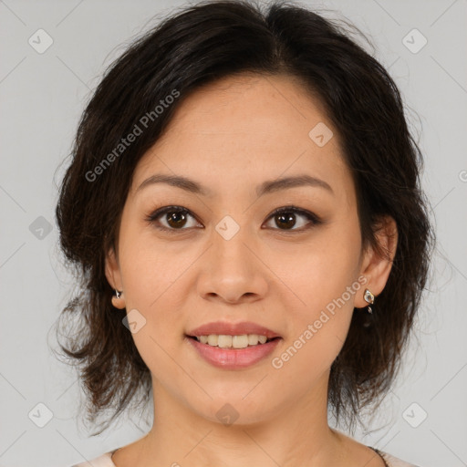 Joyful asian young-adult female with medium  brown hair and brown eyes