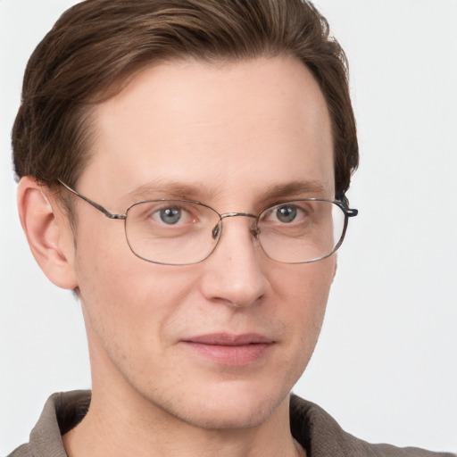 Joyful white adult male with short  brown hair and grey eyes