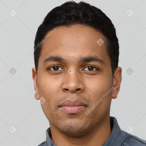 Neutral latino young-adult male with short  black hair and brown eyes