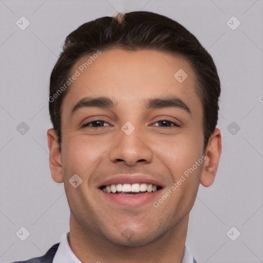 Joyful white young-adult male with short  black hair and brown eyes