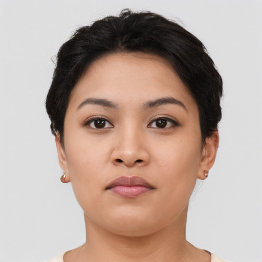 Neutral latino young-adult female with short  black hair and brown eyes