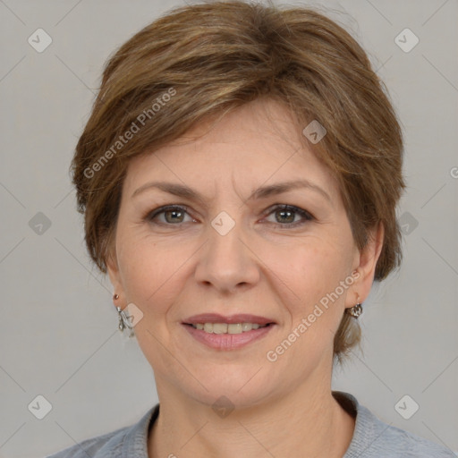 Joyful white adult female with medium  brown hair and grey eyes