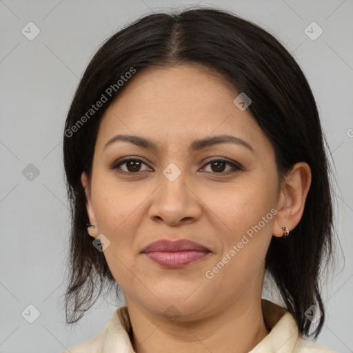 Joyful latino adult female with medium  brown hair and brown eyes