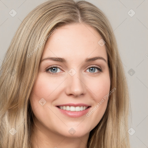 Joyful white young-adult female with long  brown hair and grey eyes