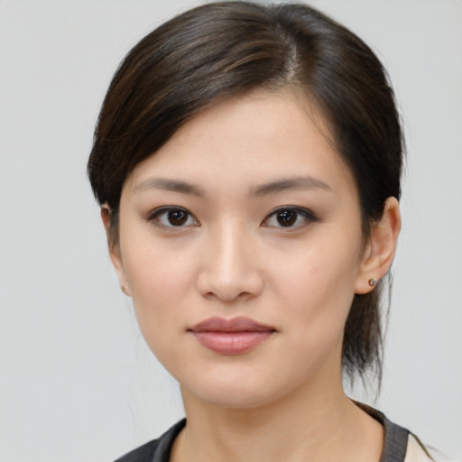 Joyful white young-adult female with medium  brown hair and brown eyes