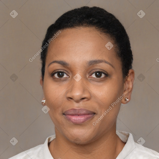 Joyful black adult female with short  black hair and brown eyes