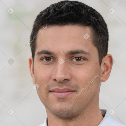 Joyful white young-adult male with short  black hair and brown eyes