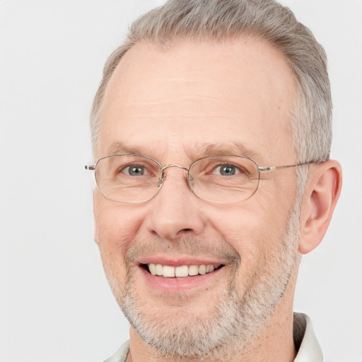 Joyful white middle-aged male with short  gray hair and brown eyes