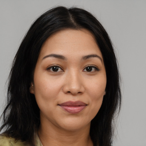 Joyful latino young-adult female with medium  brown hair and brown eyes