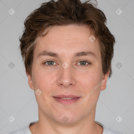 Joyful white adult male with short  brown hair and grey eyes