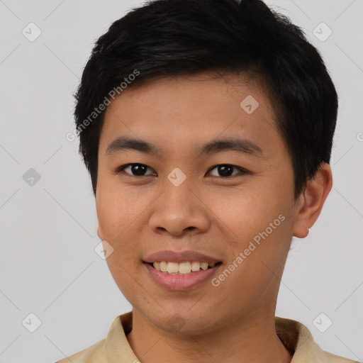 Joyful asian young-adult male with short  brown hair and brown eyes