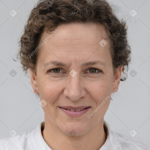 Joyful white adult female with short  brown hair and brown eyes