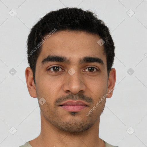 Neutral latino young-adult male with short  brown hair and brown eyes