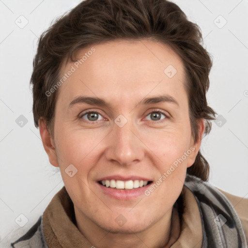 Joyful white adult female with short  brown hair and grey eyes