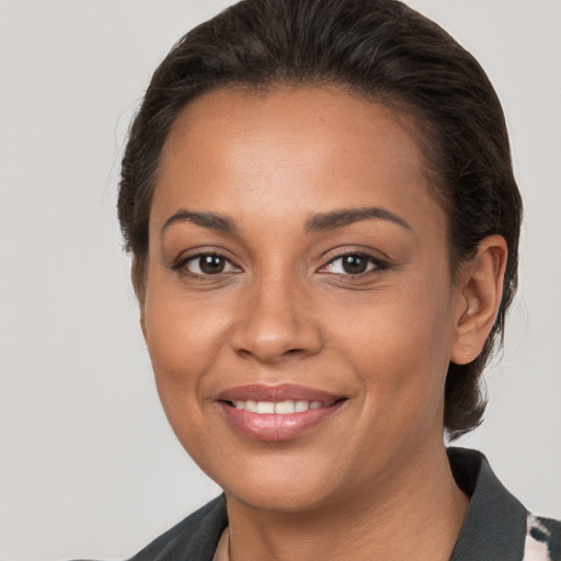 Joyful white young-adult female with medium  brown hair and brown eyes