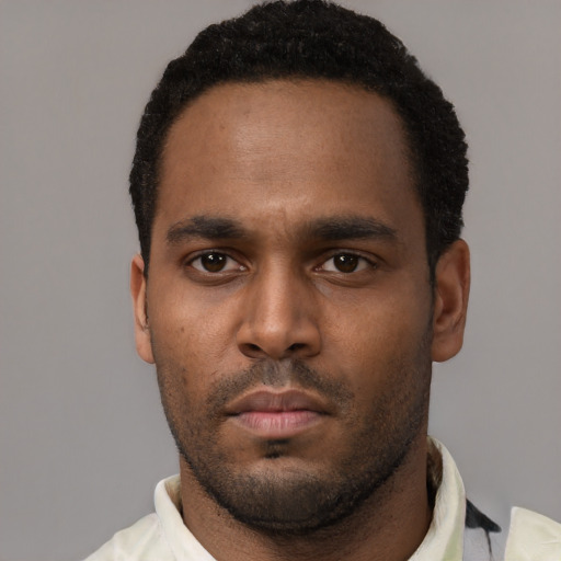 Neutral black young-adult male with short  black hair and brown eyes
