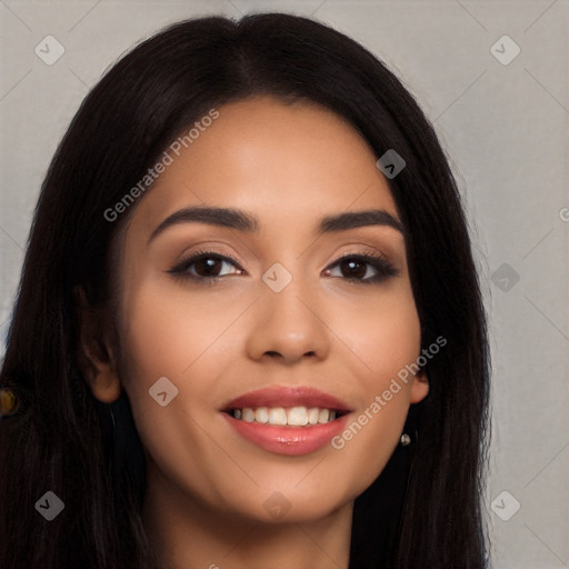 Joyful latino young-adult female with long  black hair and brown eyes