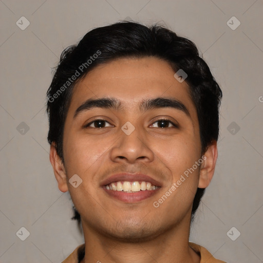 Joyful latino young-adult male with short  black hair and brown eyes