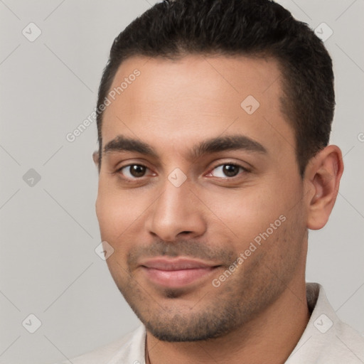 Joyful white young-adult male with short  brown hair and brown eyes