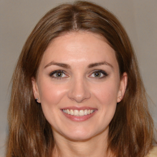 Joyful white young-adult female with medium  brown hair and brown eyes