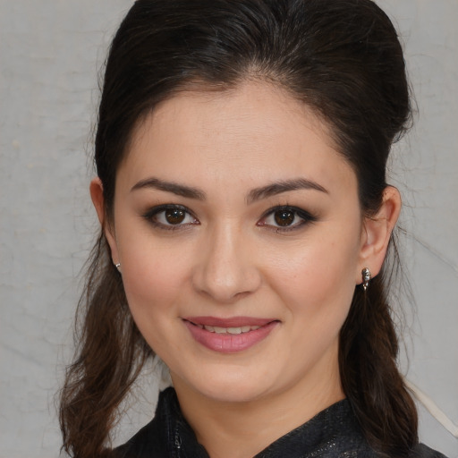 Joyful white young-adult female with medium  brown hair and brown eyes