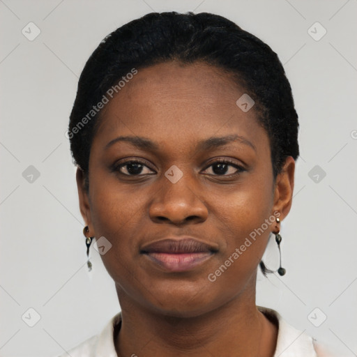 Joyful black young-adult female with short  black hair and brown eyes