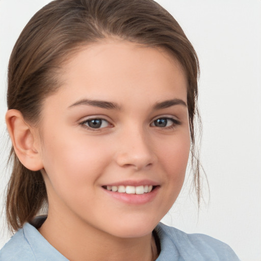 Joyful white child female with medium  brown hair and brown eyes