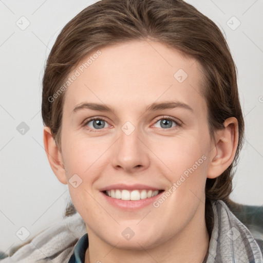 Joyful white young-adult female with medium  brown hair and grey eyes