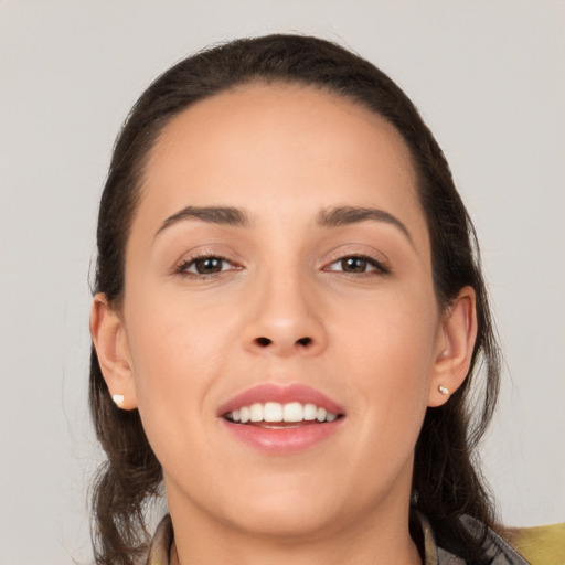 Joyful white young-adult female with medium  brown hair and brown eyes