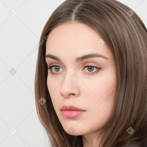 Neutral white young-adult female with long  brown hair and brown eyes