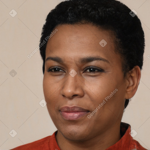 Joyful black young-adult female with short  black hair and brown eyes