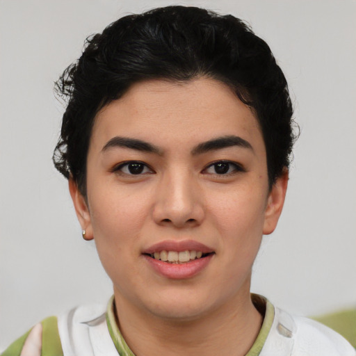 Joyful asian young-adult female with short  black hair and brown eyes