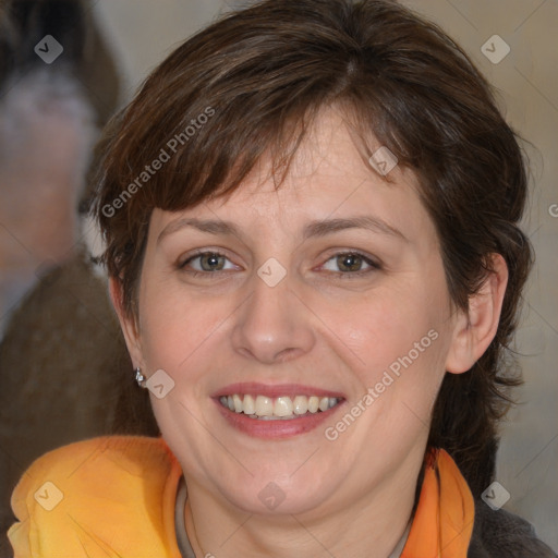 Joyful white adult female with medium  brown hair and brown eyes