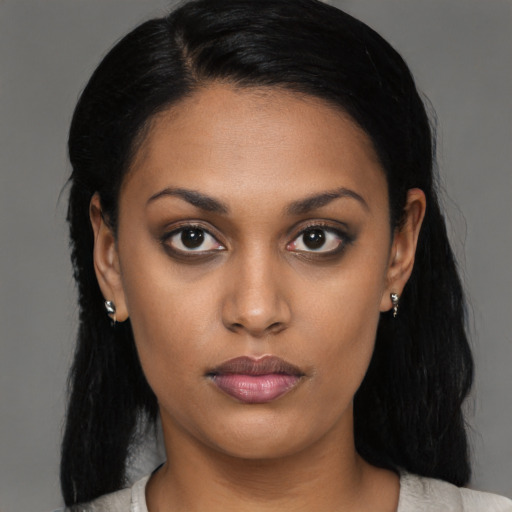 Neutral black young-adult female with medium  black hair and brown eyes