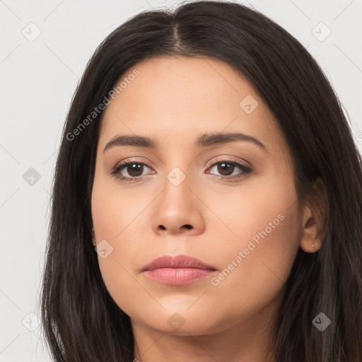 Joyful latino young-adult female with long  brown hair and brown eyes