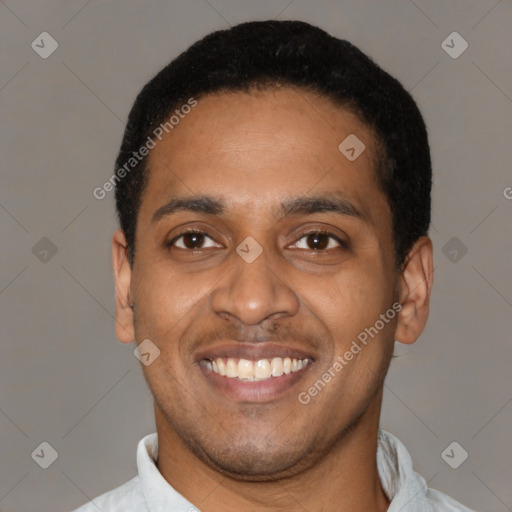 Joyful latino young-adult male with short  black hair and brown eyes