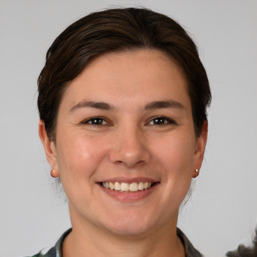 Joyful white young-adult female with short  brown hair and brown eyes