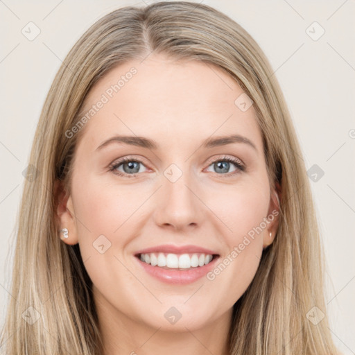 Joyful white young-adult female with long  brown hair and blue eyes