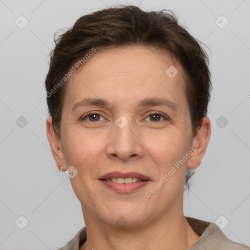 Joyful white adult female with short  brown hair and brown eyes