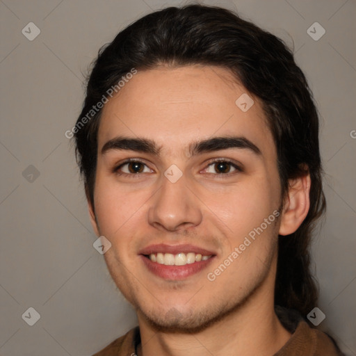 Joyful white young-adult male with medium  brown hair and brown eyes