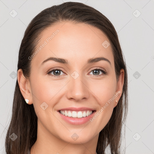 Joyful white young-adult female with long  brown hair and grey eyes