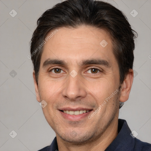 Joyful white adult male with short  brown hair and brown eyes