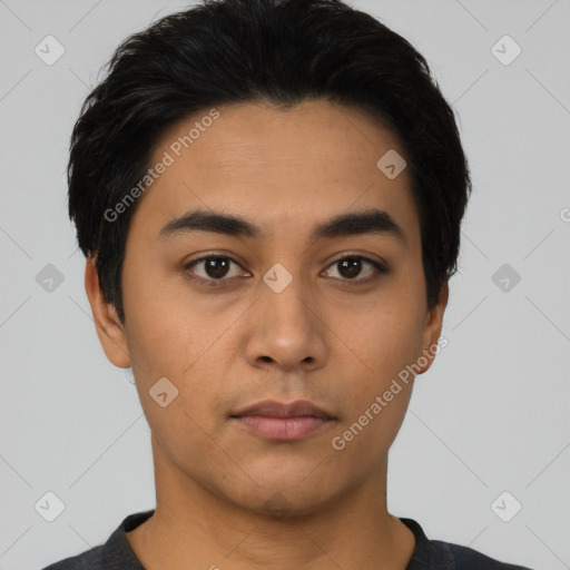 Neutral latino young-adult male with short  black hair and brown eyes