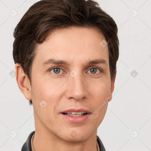 Joyful white adult male with short  brown hair and grey eyes