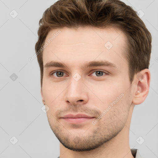 Neutral white young-adult male with short  brown hair and grey eyes