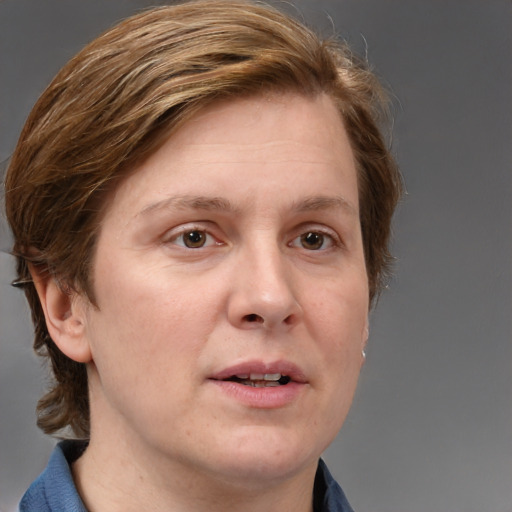 Joyful white adult female with medium  brown hair and blue eyes