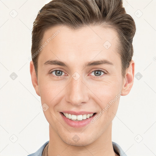 Joyful white young-adult male with short  brown hair and grey eyes