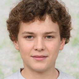 Joyful white child male with short  brown hair and brown eyes